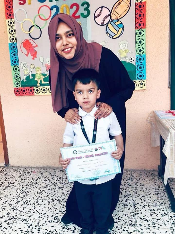 A student receiving a Sports Week athletic award